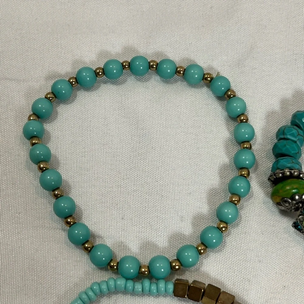 Set of four- turquoise bead bracelets.